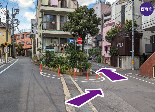 The road splits into two. Proceed down to the right. 4 minutes walk from Nishiazabu bus stop. Toei Bus RH01, Miyako 01, Shibu 88/bound for Roppongi.
